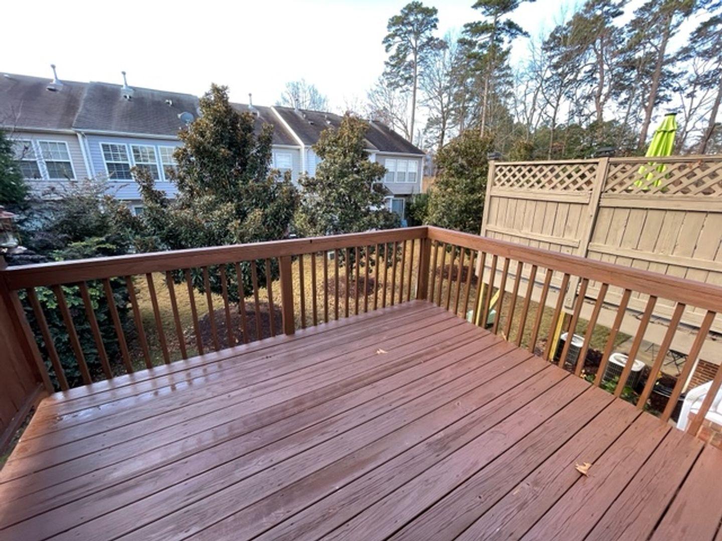 1672 Brook Fern Way Raleigh, NC 27609 - Photo 14 of 14 a balcony with wooden floor and fence
