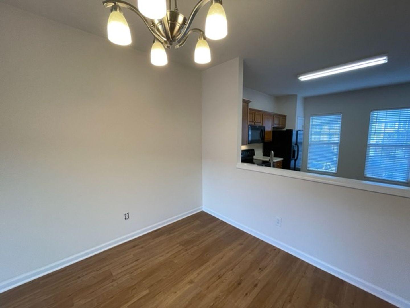 1672 Brook Fern Way Raleigh, NC 27609 - Photo 7 of 14 a view of a kitchen with a sink and a large mirror