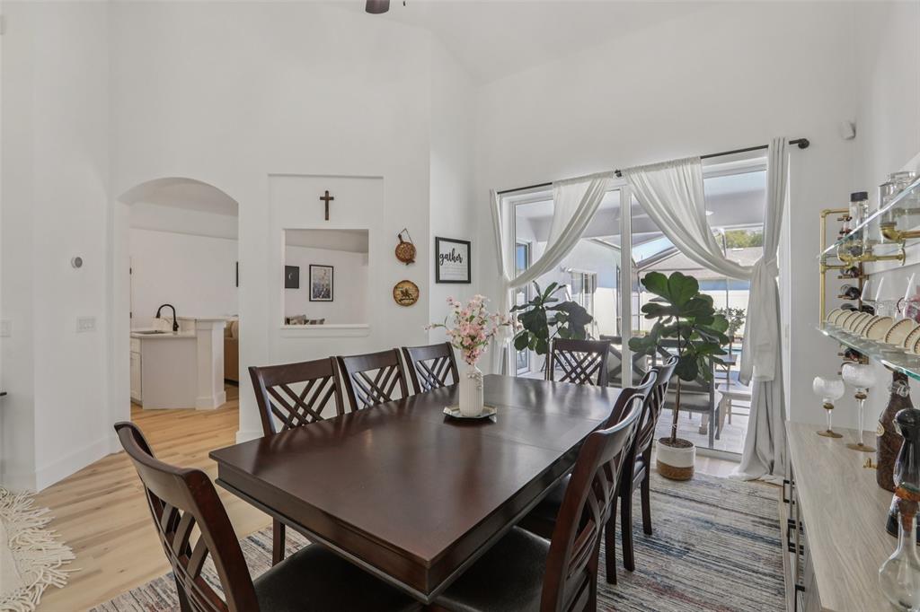 1524 Stipule Court Trinity, FL 34655 - Photo 11 of 43 a view of a dining room with furniture and wooden floor