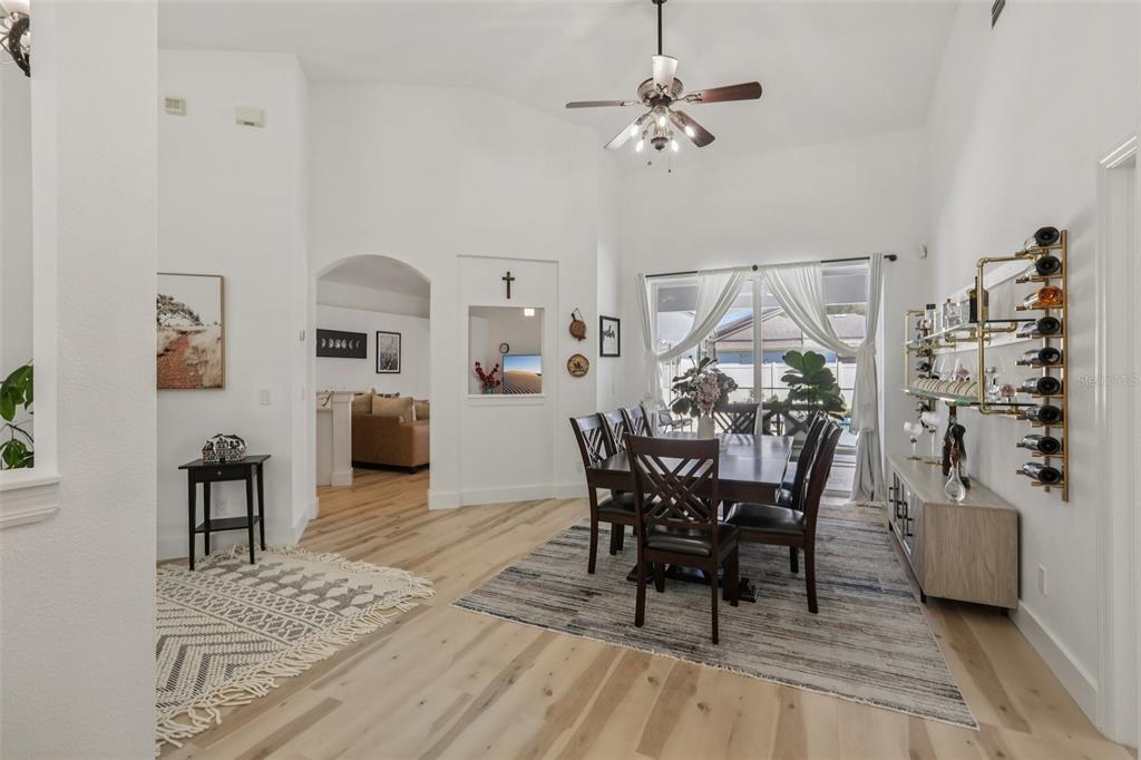 1524 Stipule Court Trinity, FL 34655 - Photo 12 of 43 a view of a dining room with furniture and chandelier