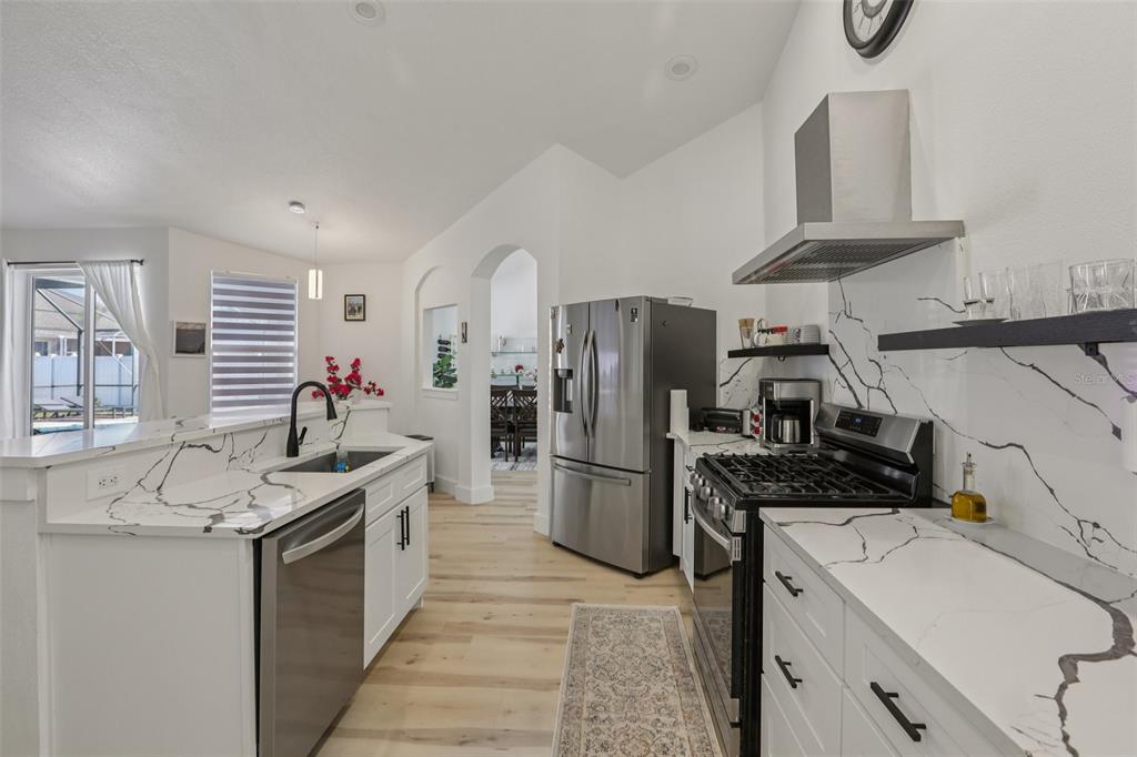 1524 Stipule Court Trinity, FL 34655 - Photo 19 of 43 a kitchen with a sink stove and refrigerator