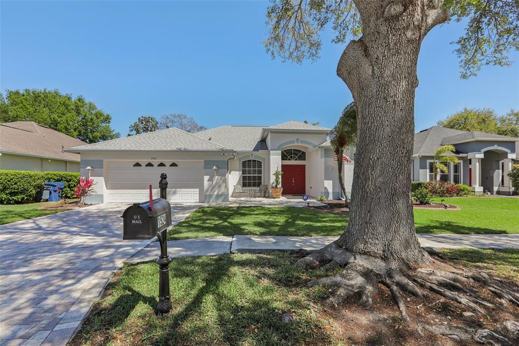 1524 Stipule Court Trinity, FL 34655 - Photo 2 of 43 a front view of a house with garden