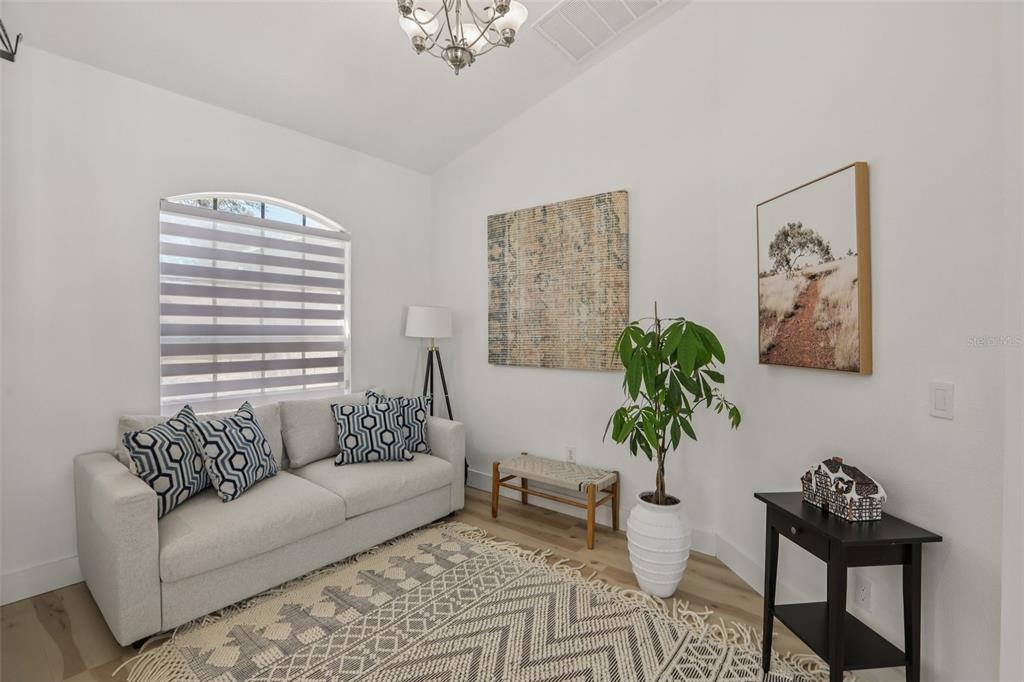 1524 Stipule Court Trinity, FL 34655 - Photo 25 of 43 a living room with furniture and a potted plant