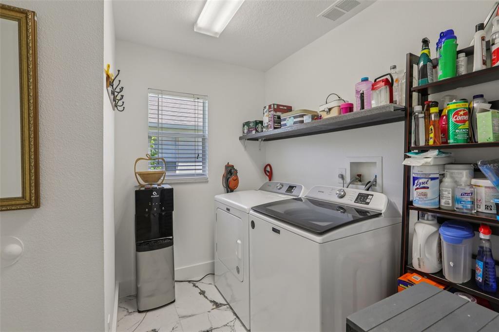 1524 Stipule Court Trinity, FL 34655 - Photo 26 of 43 a kitchen with a sink and cabinets
