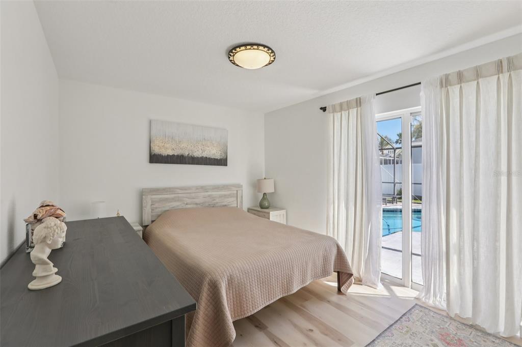 1524 Stipule Court Trinity, FL 34655 - Photo 27 of 43 a bedroom with a bed and a table