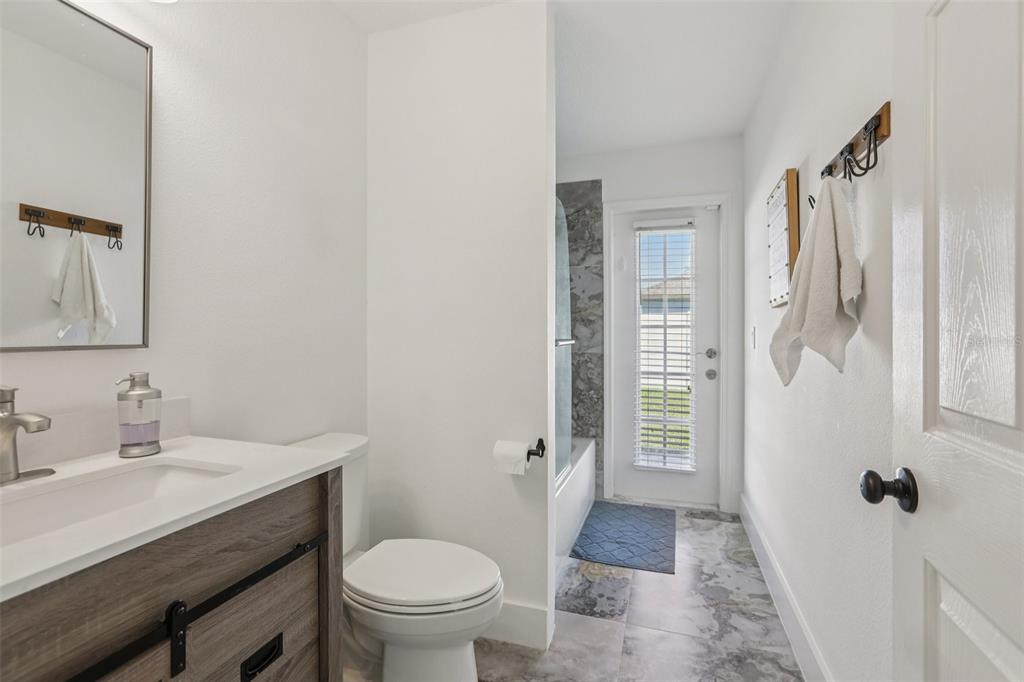 1524 Stipule Court Trinity, FL 34655 - Photo 29 of 43 a bathroom with a sink toilet and shower