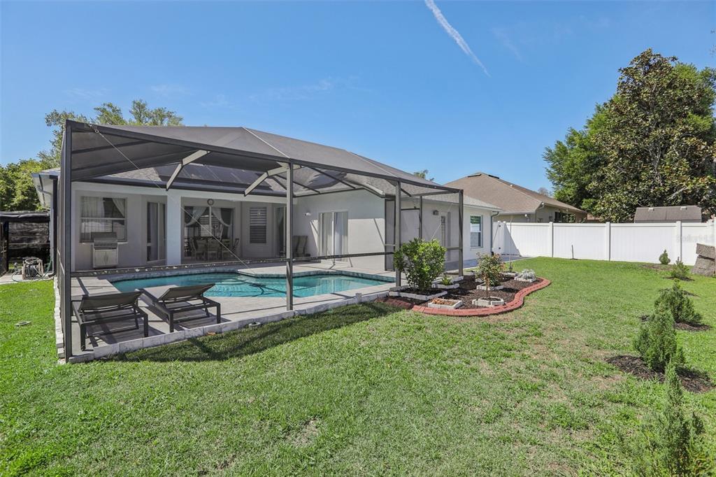 1524 Stipule Court Trinity, FL 34655 - Photo 42 of 43 a view of a house with backyard and garden
