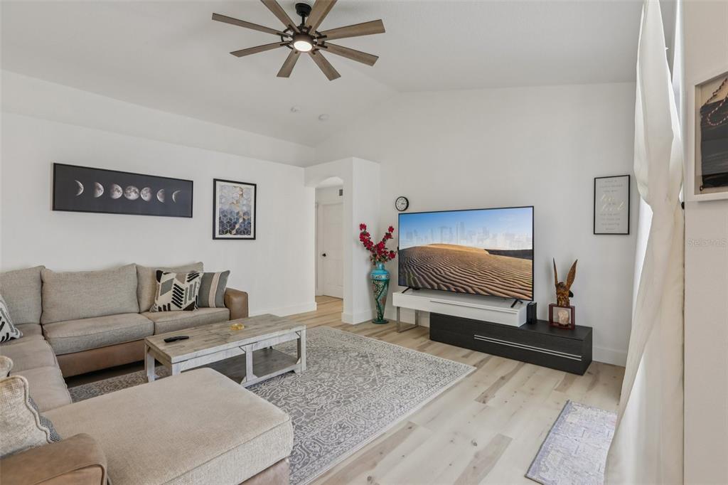 1524 Stipule Court Trinity, FL 34655 - Photo 10 of 43 a living room with furniture and a flat screen tv