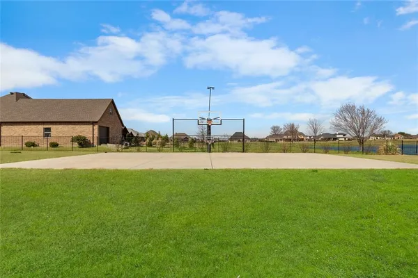 a view of a garden and basketball court
