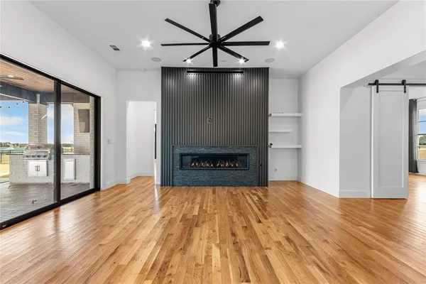 a view of livingroom with hardwood floor and a ceiling fan