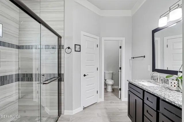 a view of a hallway with chandelier
