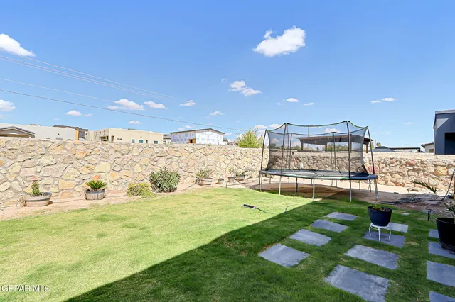 a view of living room with granite countertop fireplace