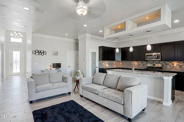 a living room with furniture and a flat screen tv