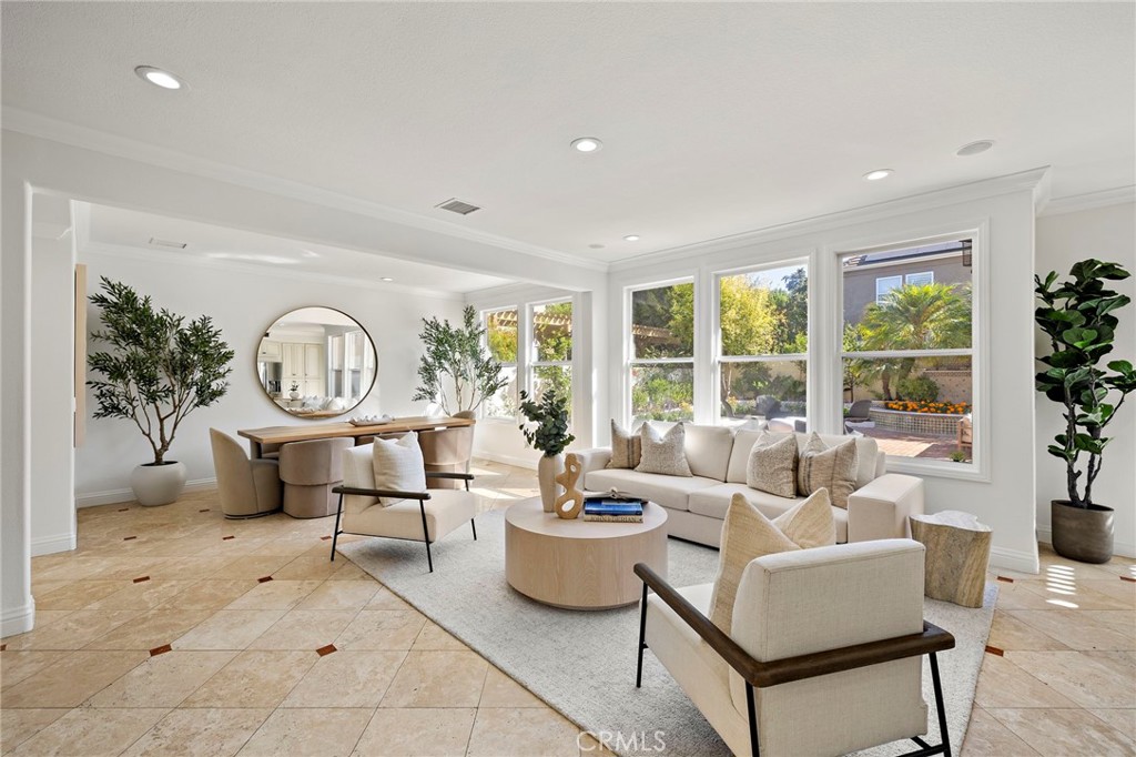 18 Bel Spring Irvine, CA 92602 - Photo 11 of 44 a living room with furniture a large window and a potted plant