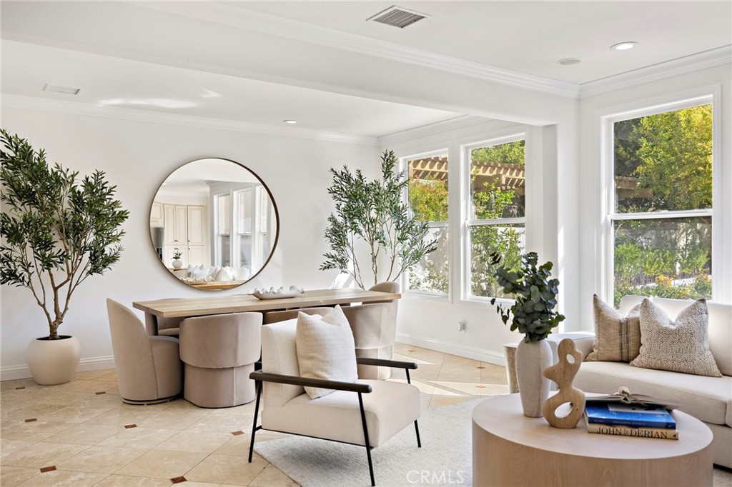 18 Bel Spring Irvine, CA 92602 - Photo 12 of 44 a living room with furniture a large window and a potted plant