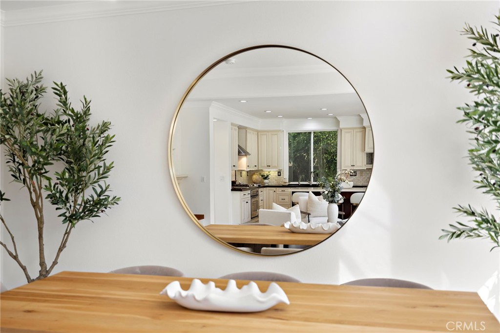 18 Bel Spring Irvine, CA 92602 - Photo 16 of 44 a living room with a table and chairs