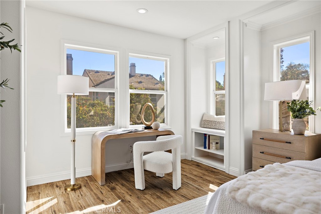 18 Bel Spring Irvine, CA 92602 - Photo 22 of 44 a bedroom with furniture and a window