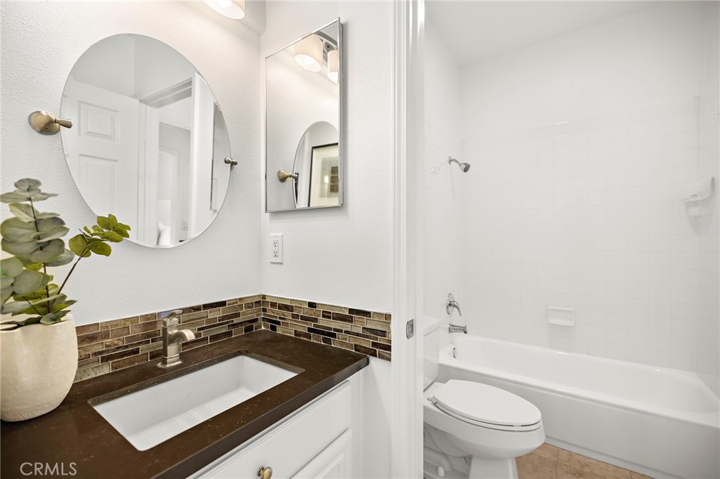 18 Bel Spring Irvine, CA 92602 - Photo 29 of 44 a bathroom with a sink a toilet and a bathtub