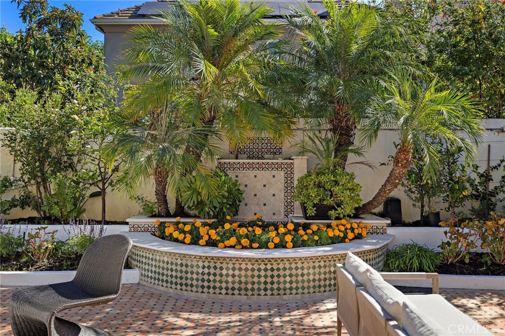 18 Bel Spring Irvine, CA 92602 - Photo 36 of 44 a view of a deck with table and chairs and potted plants