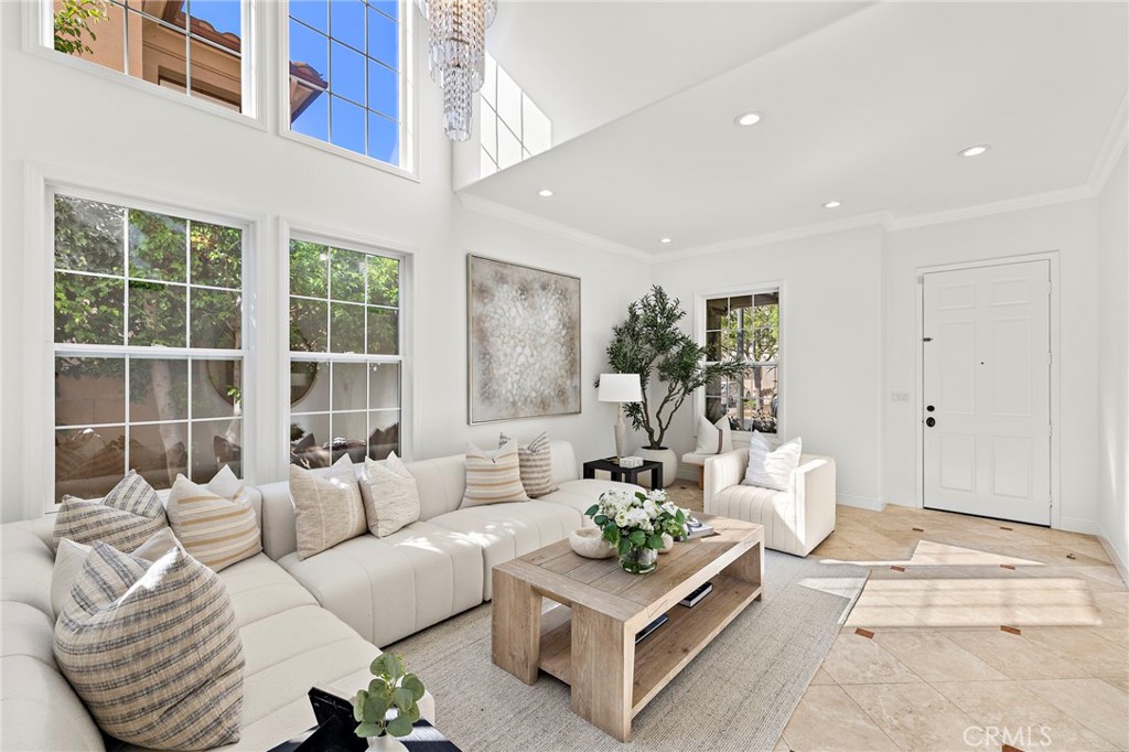 18 Bel Spring Irvine, CA 92602 - Photo 7 of 44 a living room with furniture and a large window