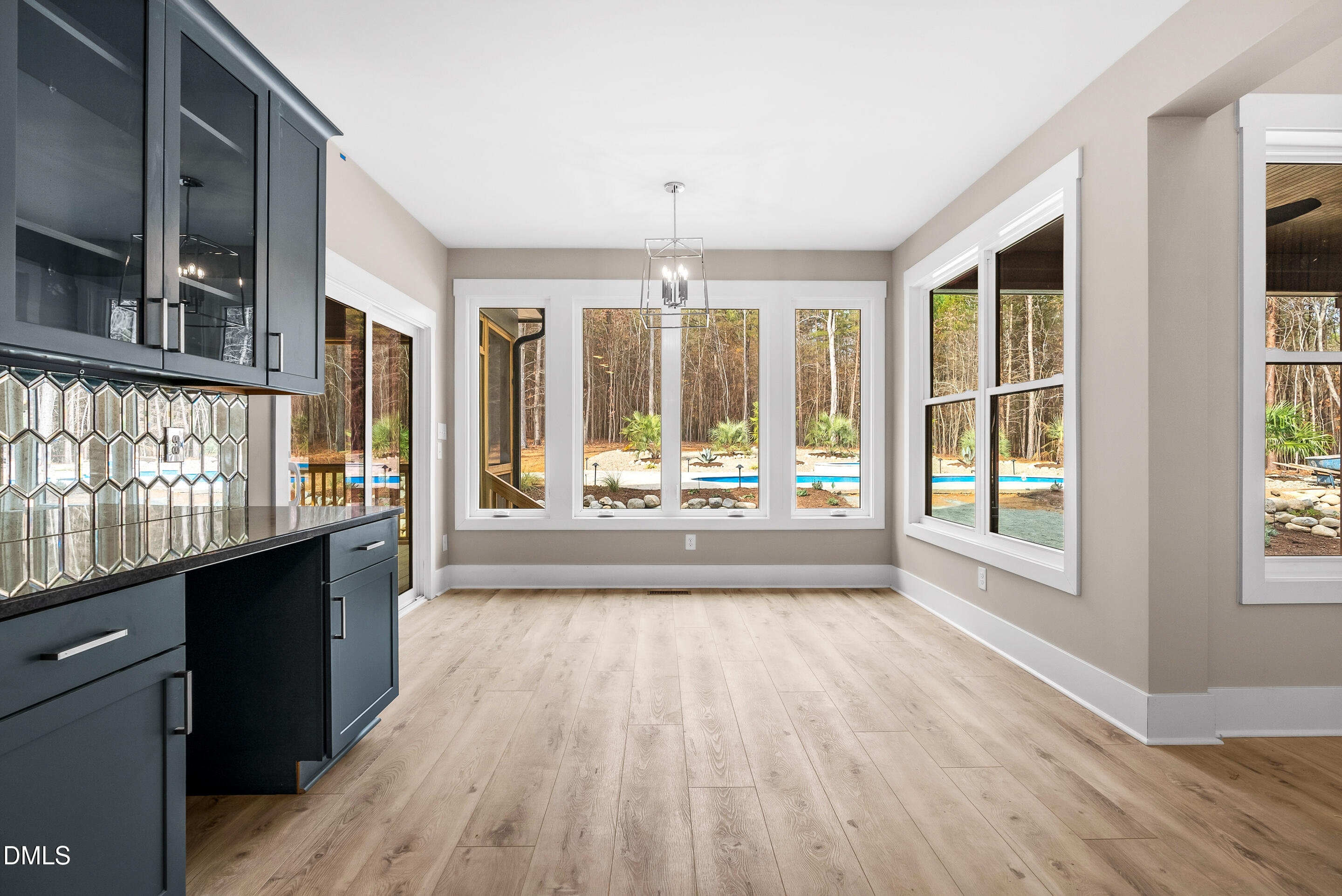 1200 Lake Wendell Road Wendell, NC 27591 - Photo 5 of 11 a view of an empty room with wooden floor and a window