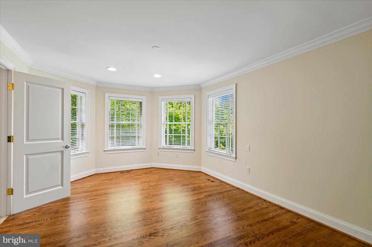 2700 Falling Timber Trail Edgewater, MD 21037 - Photo 43 of 89 an empty room with wooden floor and windows