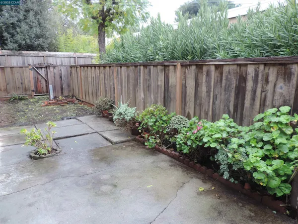a backyard of a house with a garden