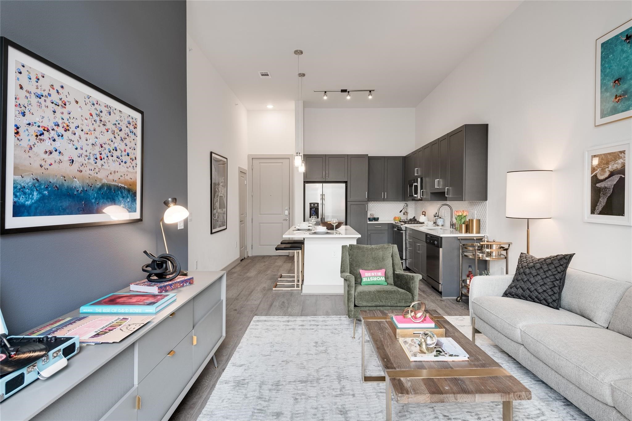 Open-concept living with high windows that fill the space with natural light.