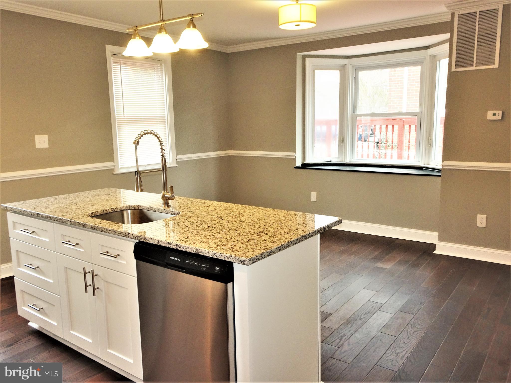 1216 Glenhaven Road Baltimore, MD 21239 - Photo 12 of 45 Dinning room w/ bay window and great natural light