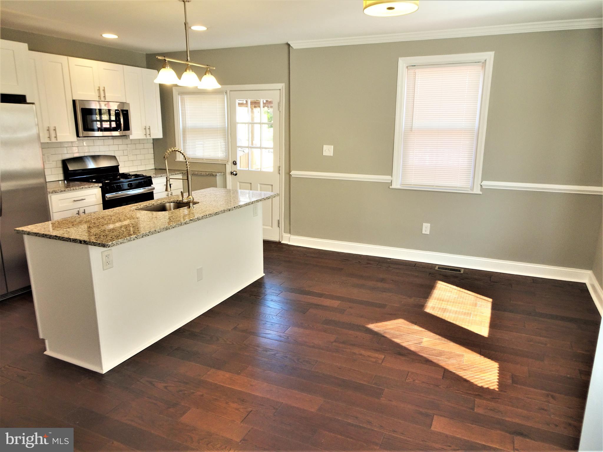 1216 Glenhaven Road Baltimore, MD 21239 - Photo 45 of 45 Open floor plan kit/DR /LR - crown & chair rail
