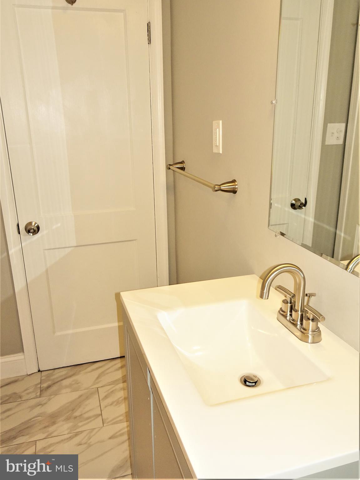 1216 Glenhaven Road Baltimore, MD 21239 - Photo 21 of 45 Bath w/ full linen closet and vanity storage