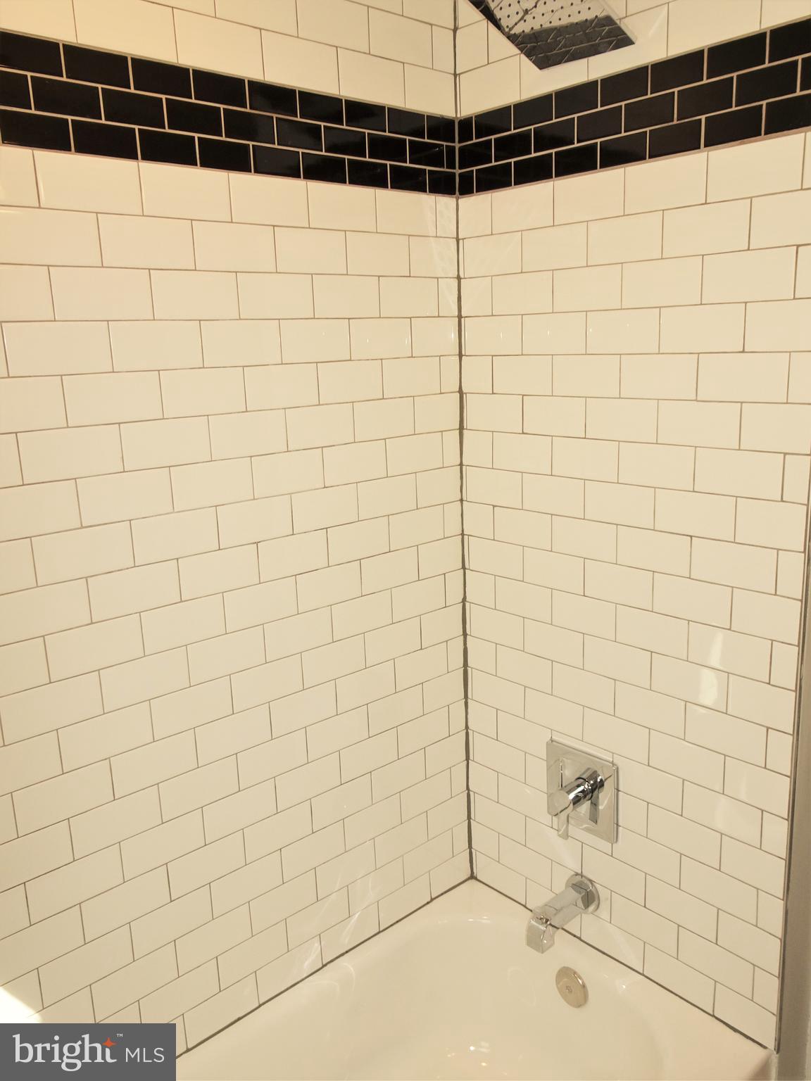 1216 Glenhaven Road Baltimore, MD 21239 - Photo 22 of 45 Tub / shower surround w/ classic subway tile