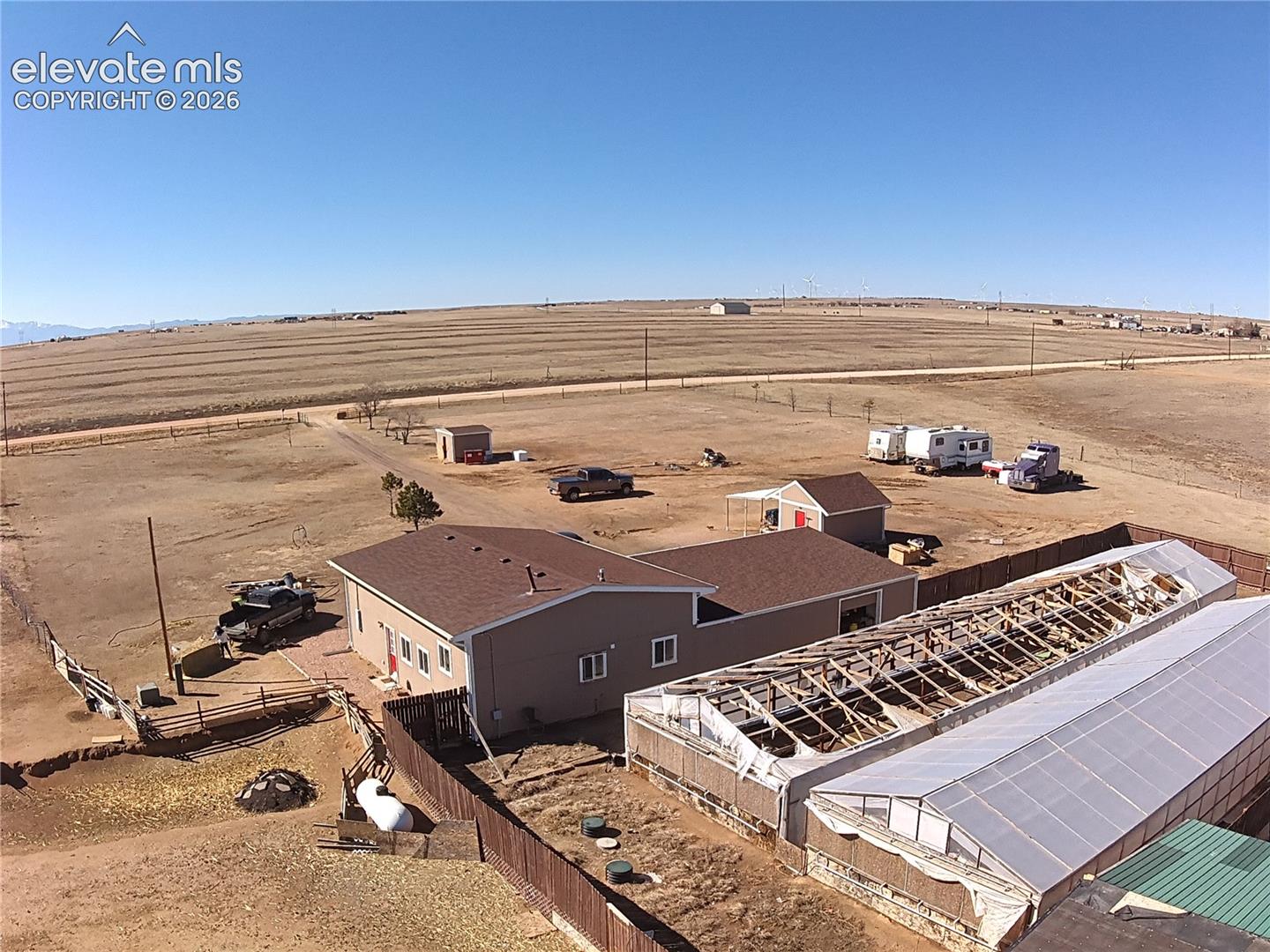 3835 Sengbeil Road Yoder, CO 80864 - Photo 47 of 48 Expansive rural property featuring a beige-sided residence with brown shingle roofing