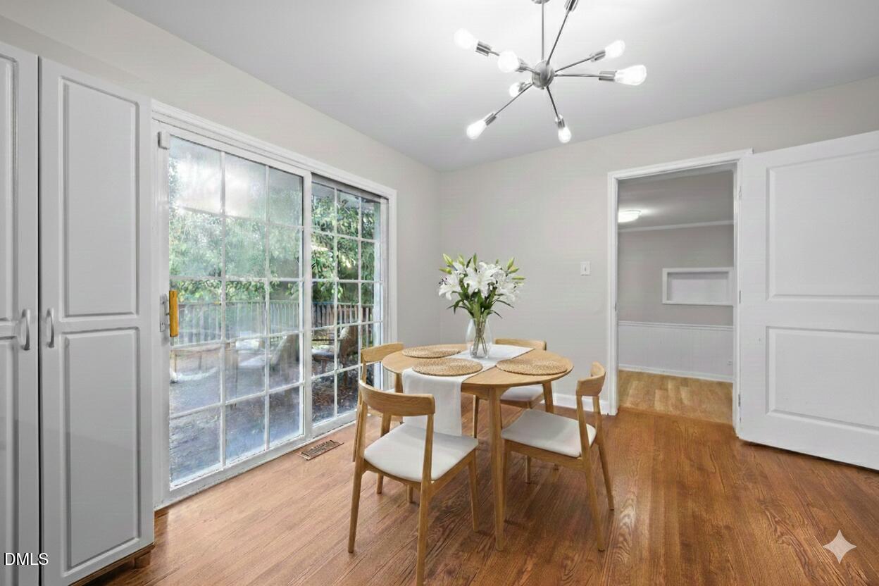 2950 Glenridge Drive Raleigh, NC 27604 - Photo 14 of 53 a view of a dining room with furniture window and wooden floor