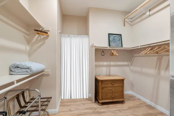 a view of a hallway with entryway door