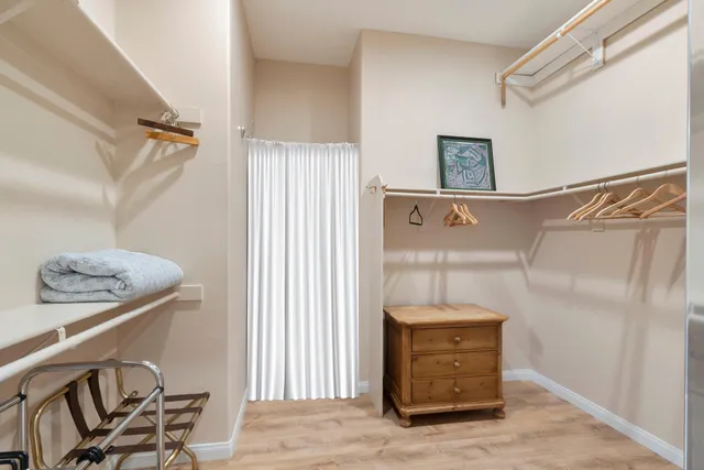 a view of a hallway with entryway door