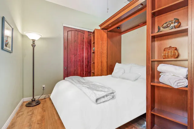 a kitchen with a sink a counter and chairs