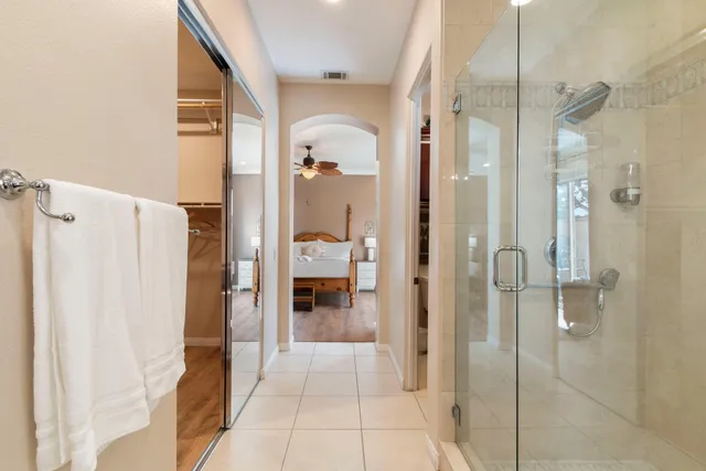 a bathroom with a sink double vanity and a mirror