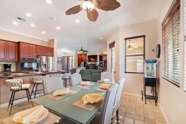 a living room with fireplace furniture and a flat screen tv