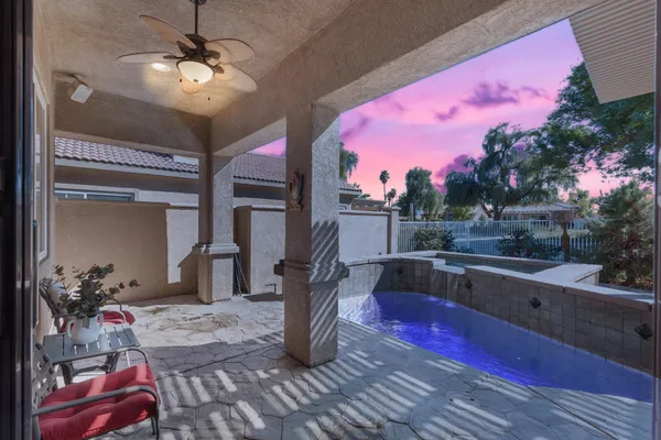 a dinning area with pool table and chairs