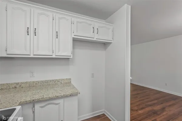 a view of cabinets and wooden floor
