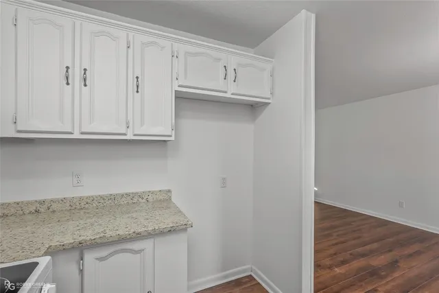 a view of cabinets and wooden floor