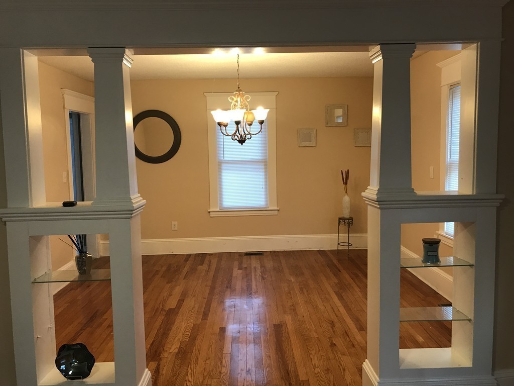 97 Penacook Street Springfield, MA 01104 - Photo 8 of 11 a view of a livingroom with wooden floor and a large window
