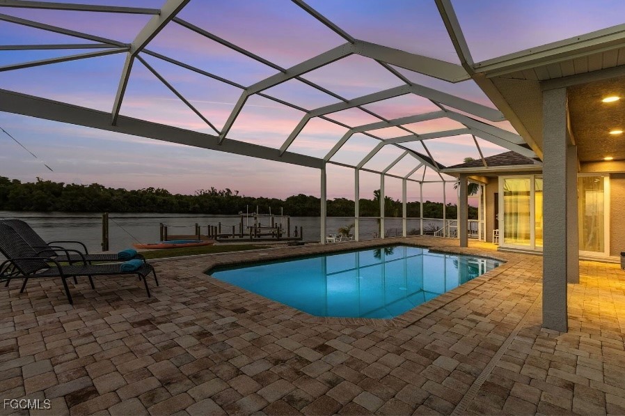 4885 East Riverside Drive Fort Myers, FL 33905 - Photo 31 of 45 a view of a swimming pool with a patio