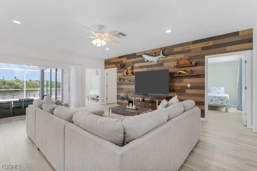 4885 East Riverside Drive Fort Myers, FL 33905 - Photo 4 of 45 a living room with furniture and a large window