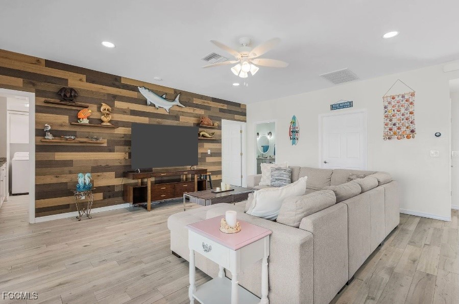 4885 East Riverside Drive Fort Myers, FL 33905 - Photo 5 of 45 a living room with furniture and a flat screen tv