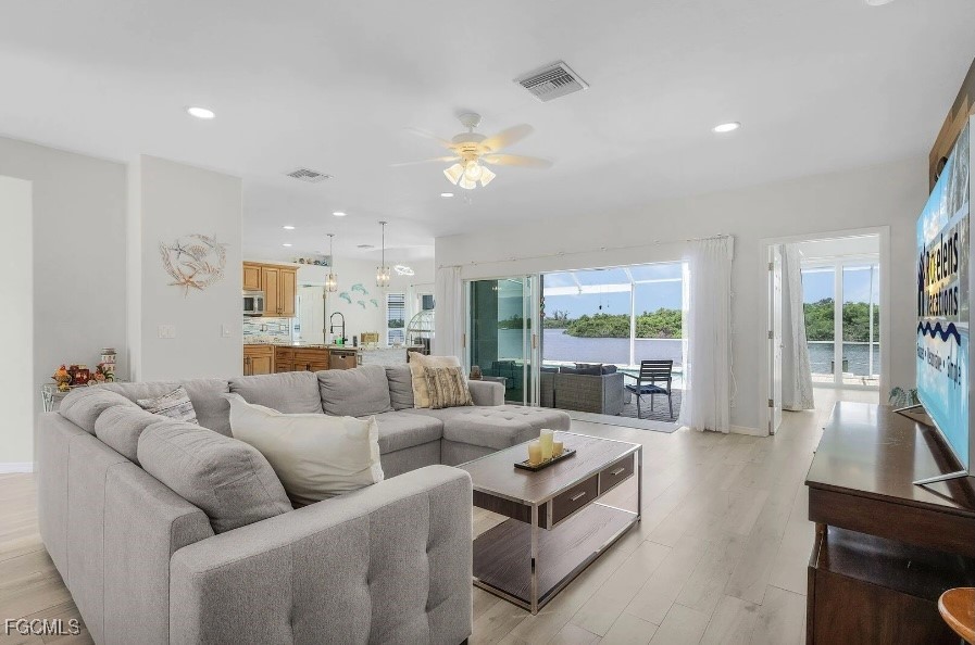 4885 East Riverside Drive Fort Myers, FL 33905 - Photo 7 of 45 a living room with furniture and a large window
