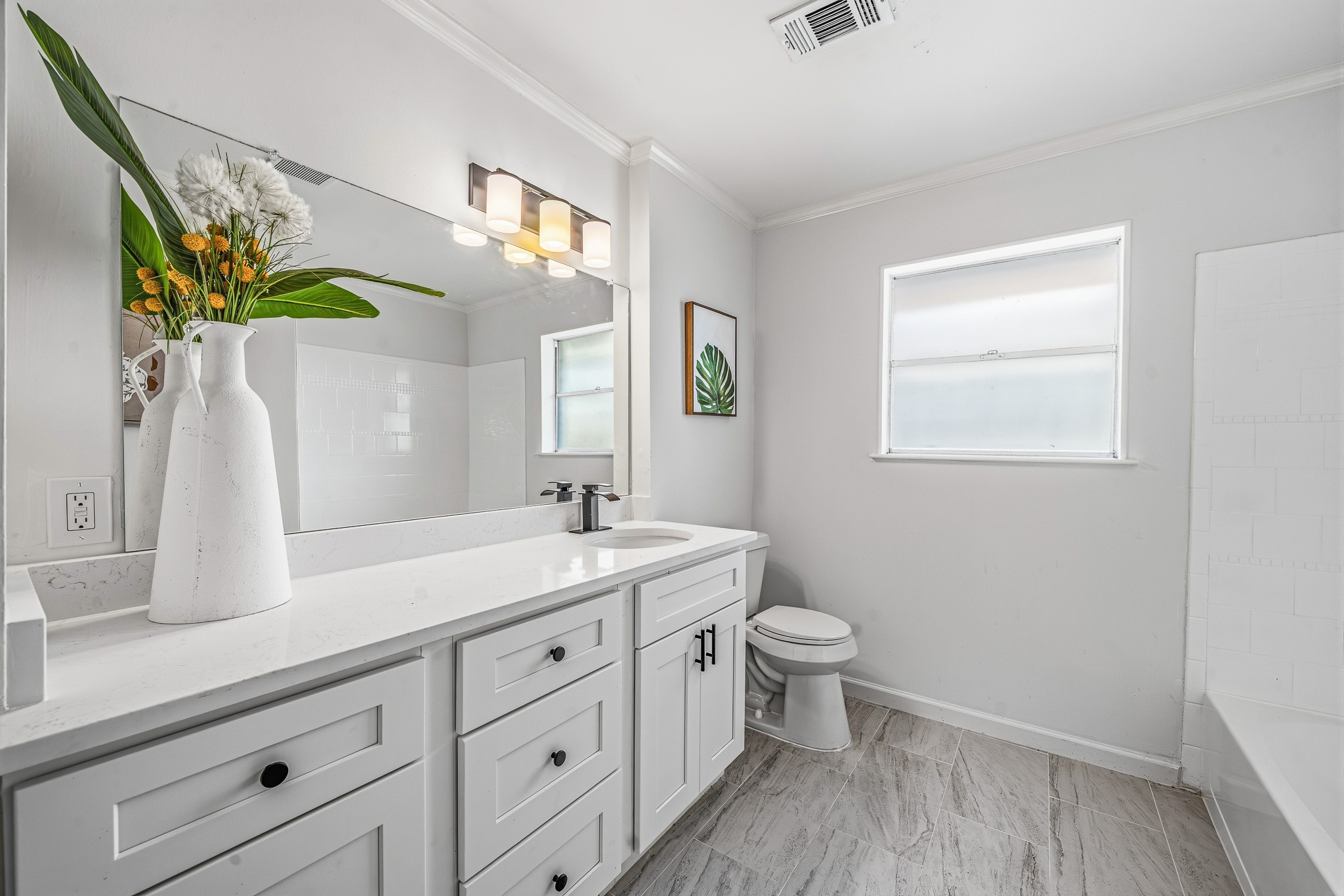 111 Princess Drive Houston, TX 77034 - Photo 10 of 30 a spacious bathroom with a double vanity sink toilet and a mirror