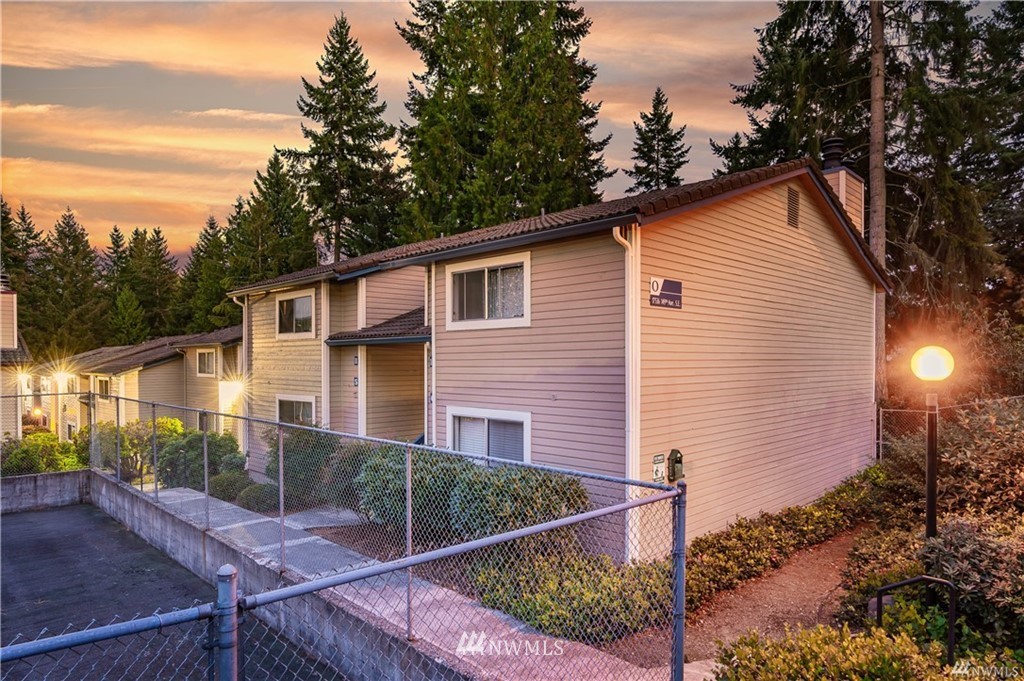 17536 149th Avenue Southeast, Unit O12 Renton, WA 98058 - Photo 1 of 12 a view of a house with backyard and sitting area