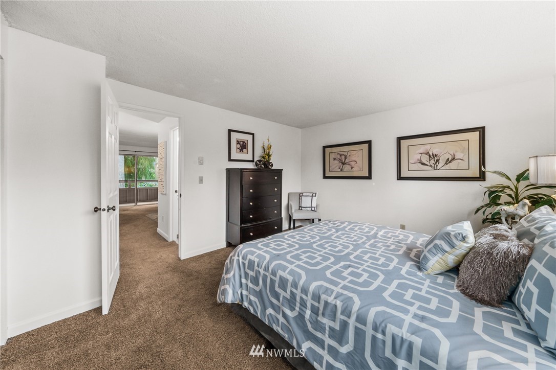 17536 149th Avenue Southeast, Unit O12 Renton, WA 98058 - Photo 9 of 12 a bedroom with a bed and a cabinets